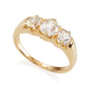 An antique 18ct yellow gold three stone diamond ring, set with old brilliant cut diamonds.