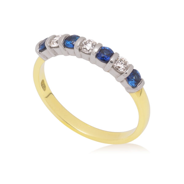 An 18ct yellow and white gold round brilliant cut sapphire and diamond seven stone half eternity ring, with a bar setting.