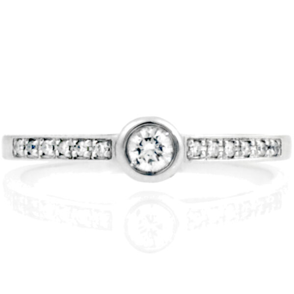 An 18ct white gold round brilliant cut diamond single stone ring with diamond set shoulders.